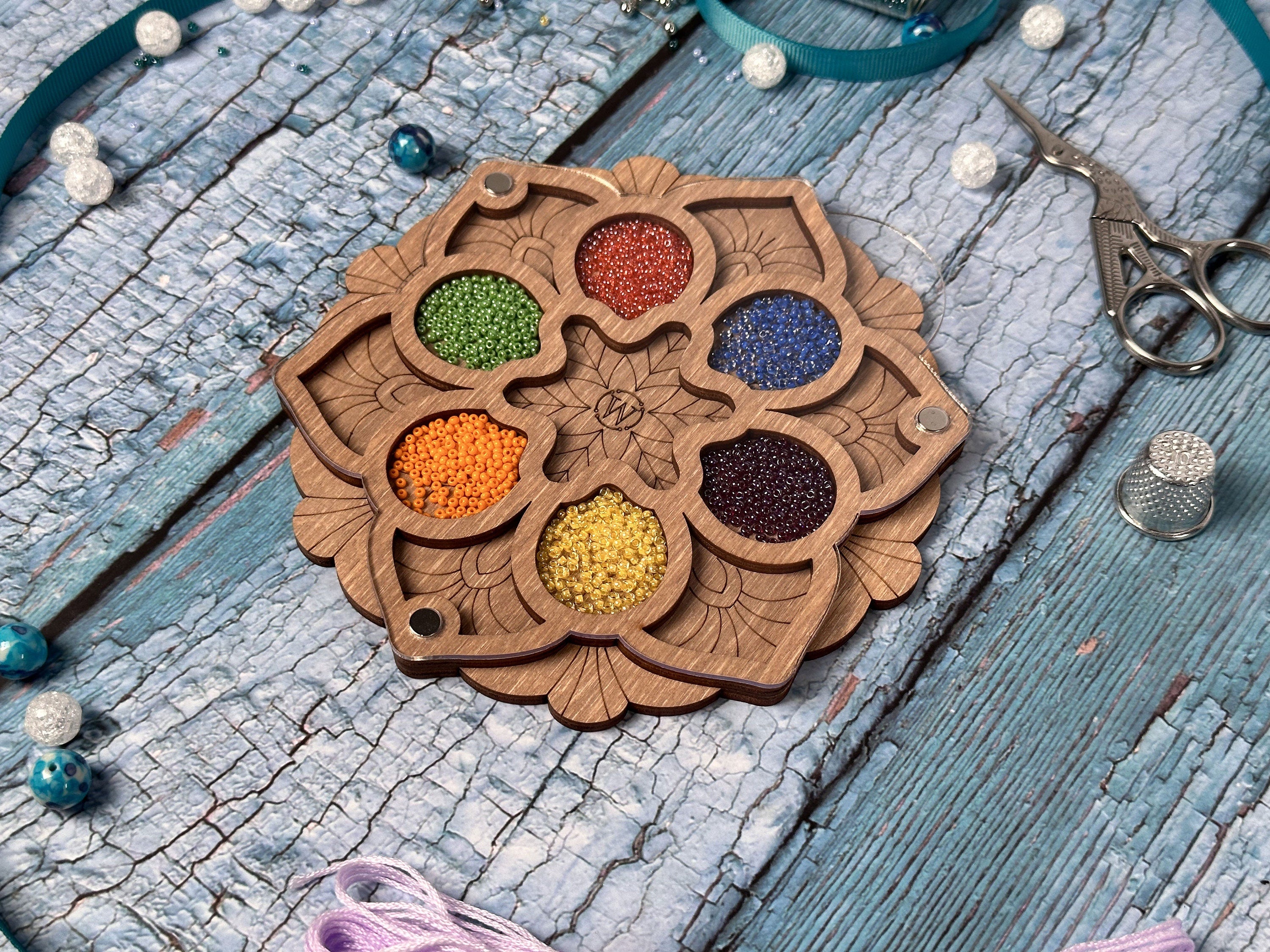 a wooden keychain with beads and beads on it